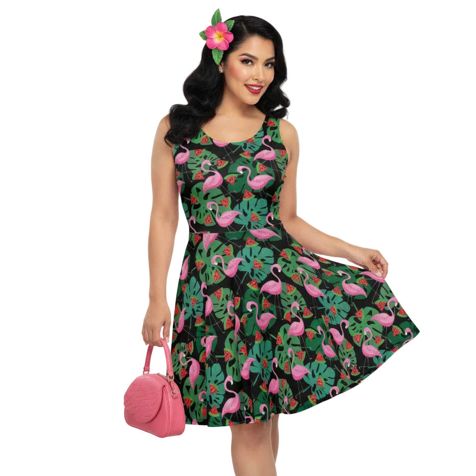 Plus size woman wearing a 1950s vintage-inspired fit and flare swing dress with a tropical flamingo and watermelon print.