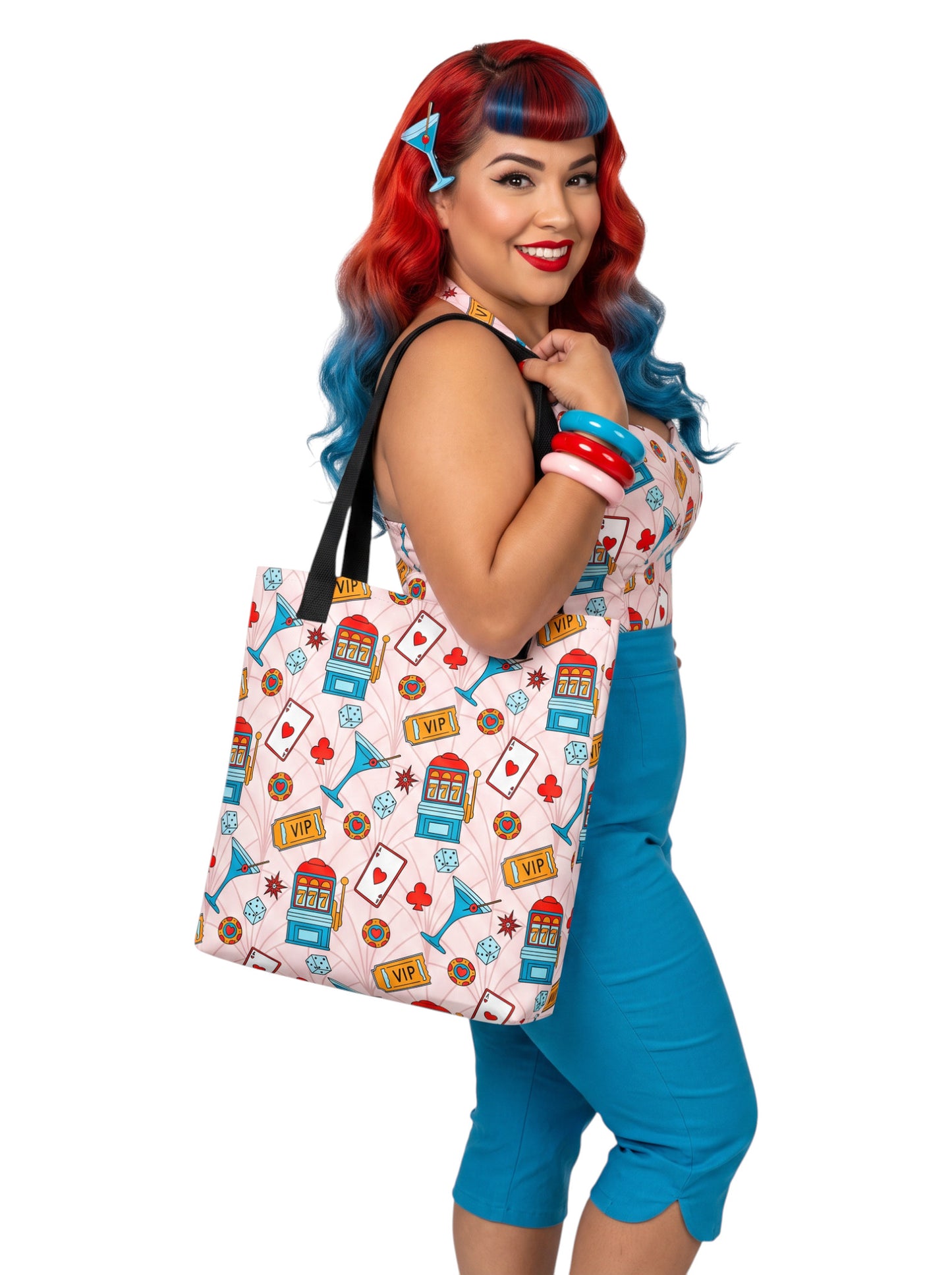 A woman wearing a martini Las Vegas Casino Pinup 1950s Rockabilly Tote Bag with retro slot machine and dice pattern.