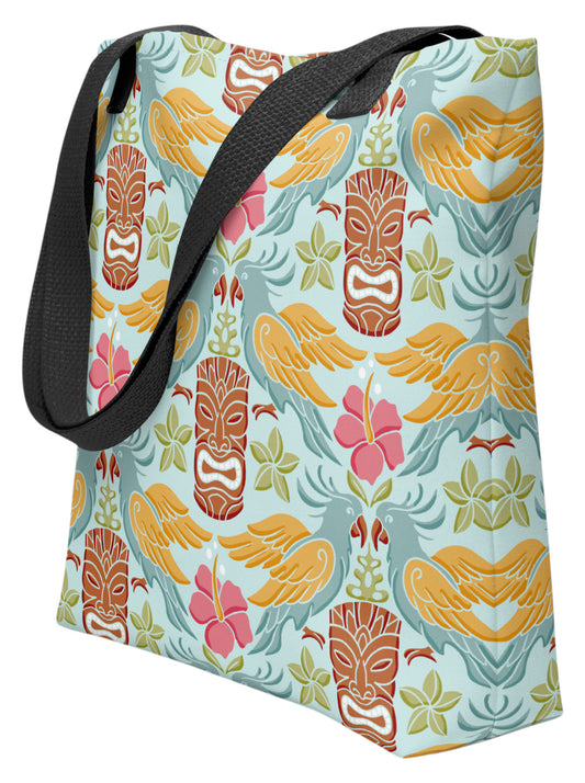Tiki mask bird and hibiscus flower pattern tropical pinup tote bag with black handles.