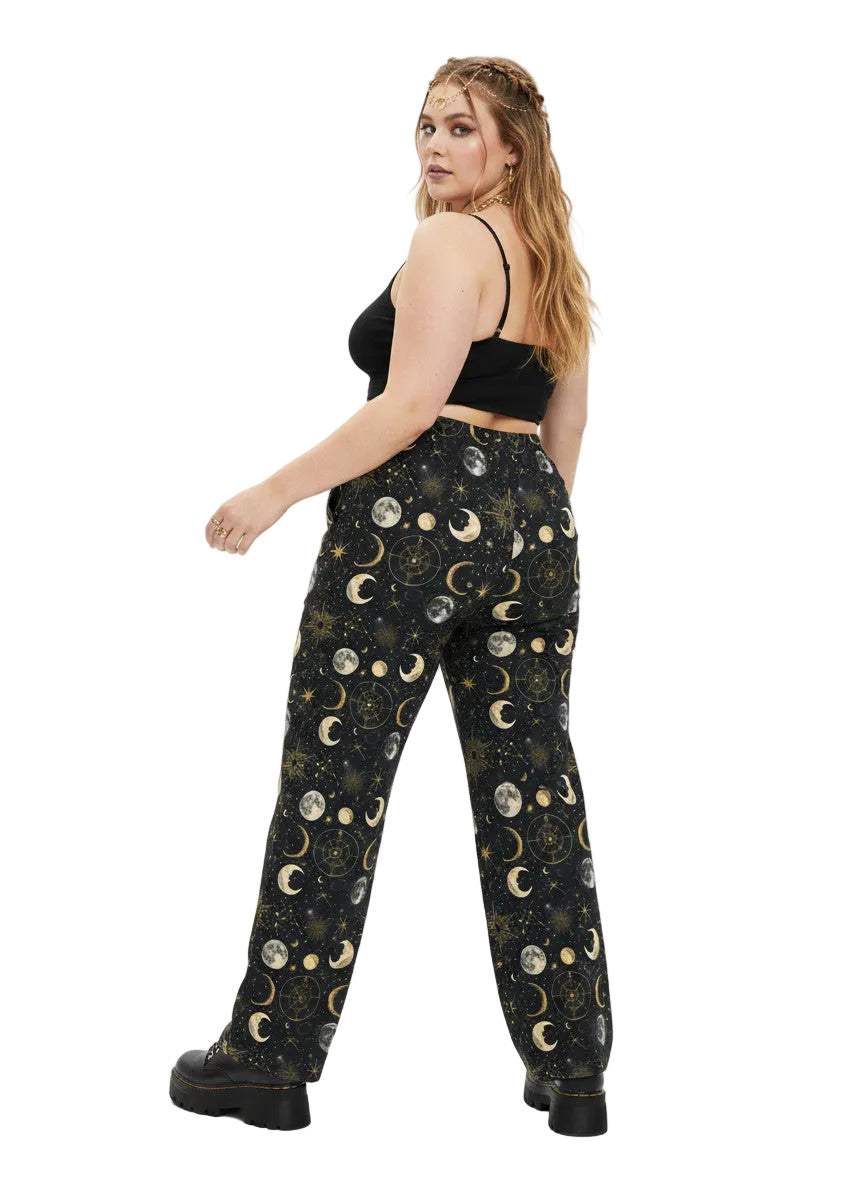 Woman wearing Whimsigoth celestial wide leg lounge pants with sun, moon, and star print.