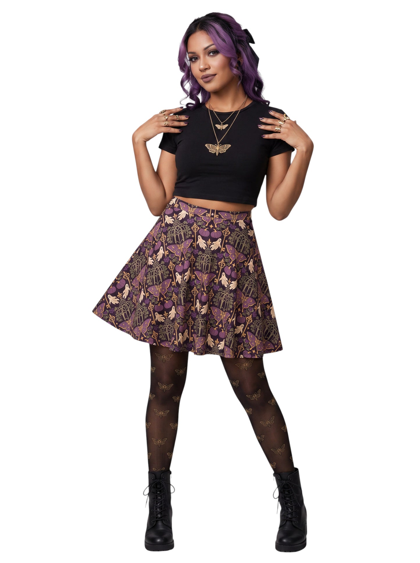 Woman wearing a purple Whimsigoth moth print goth flare skirt with black crop top and moth tights.