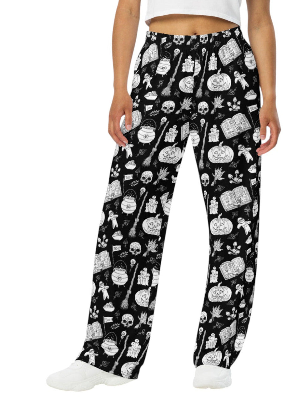 Woman wearing black and white witchy voodoo doll print wide leg lounge pants with side pockets.