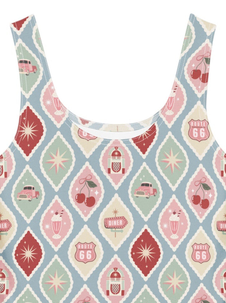 A 1950s style cherry diner milkshake pattern swing dress made of high stretch fabric