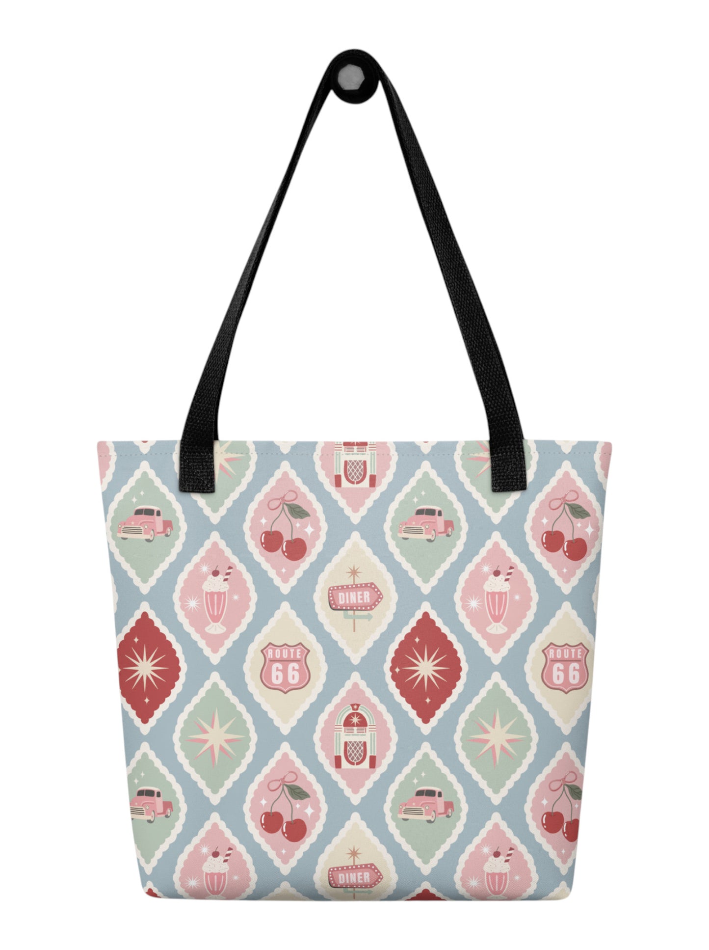 1950s diner retro tote bag with pastel pinup pattern featuring cherries, milkshakes, and jukeboxes on a light blue background with black straps.