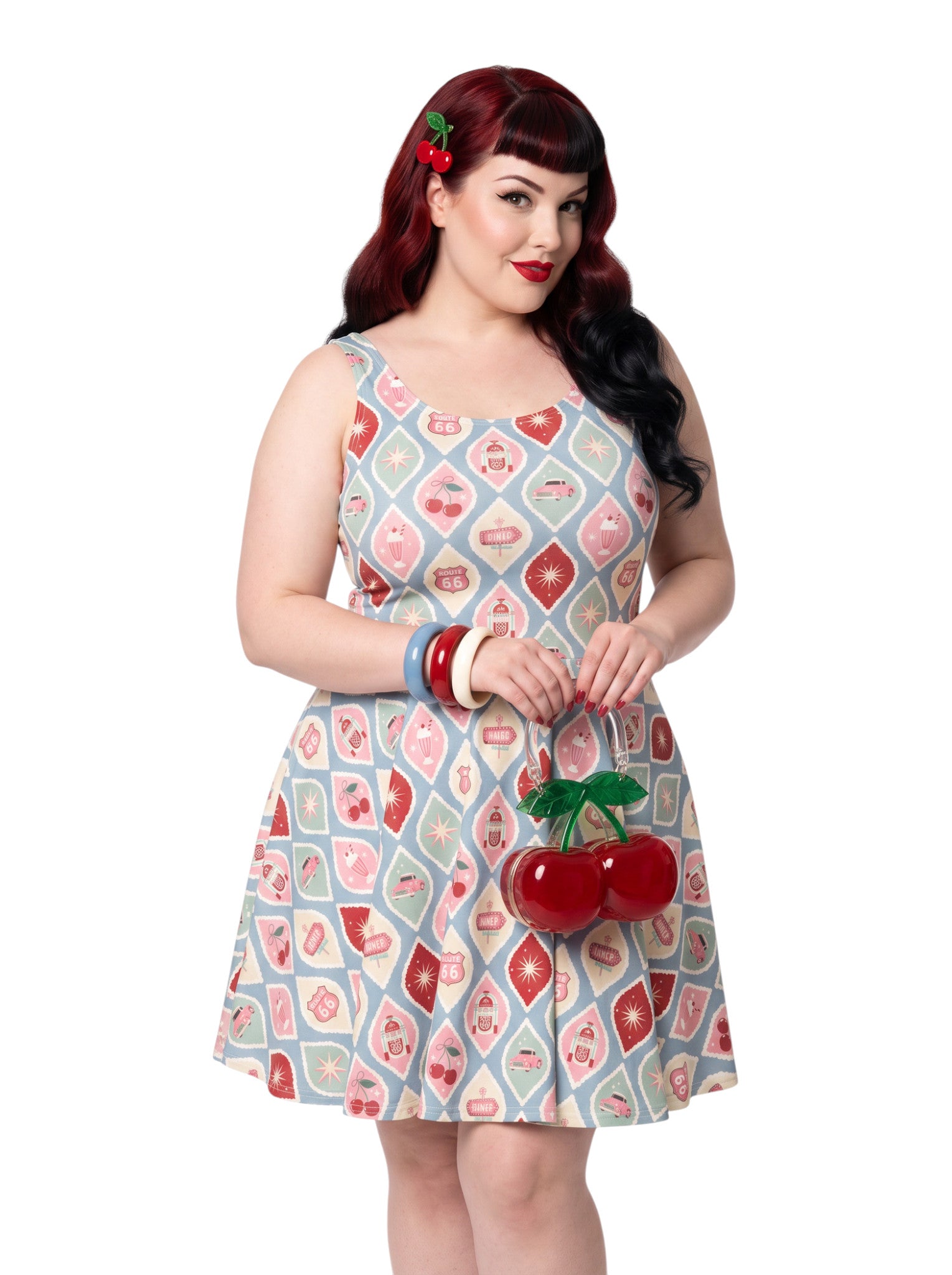 Plus size pinup woman wearing a 1950s style cherry diner milkshake pattern swing dress made of high stretch fabric