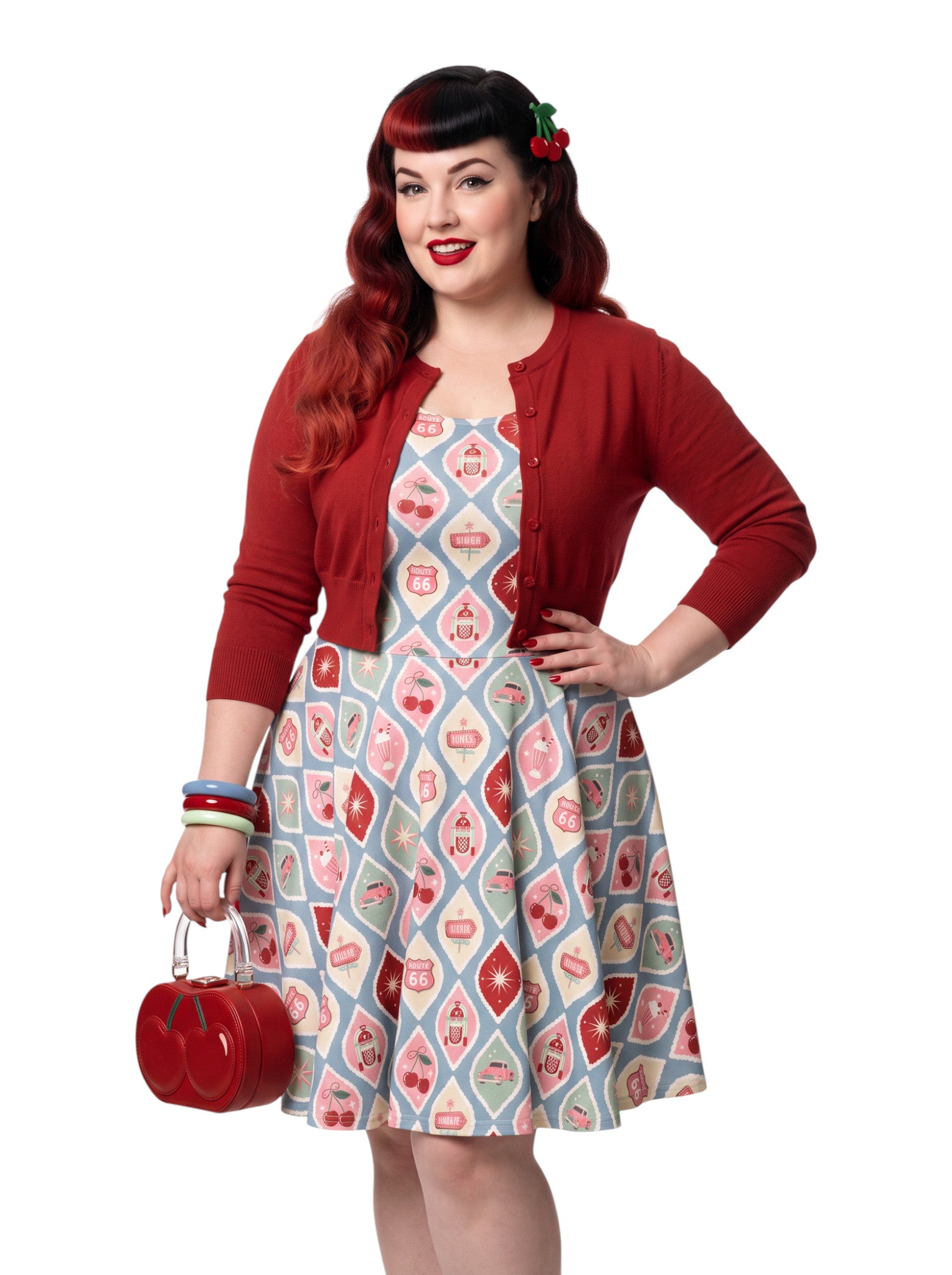 Plus size pinup woman wearing a 1950s style cherry diner milkshake pattern swing dress made of high stretch fabric