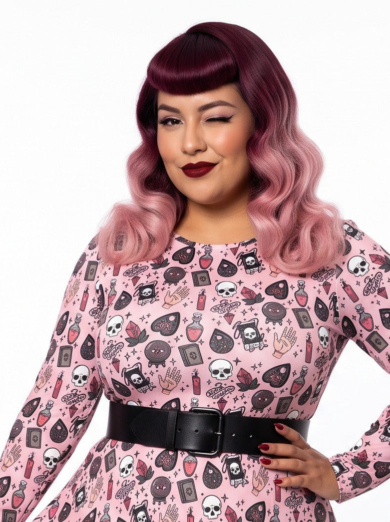Women wearing 1950s witchy print pinup swing dress.