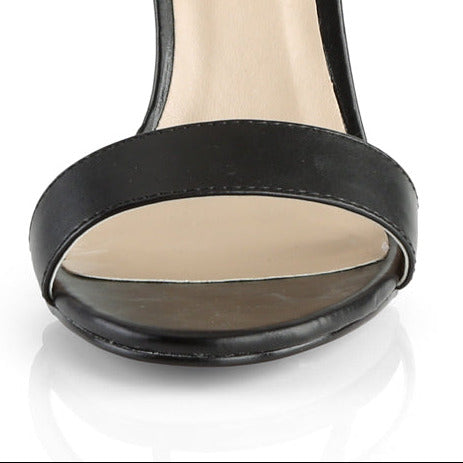 Black ankle strap stiletto heel on white background