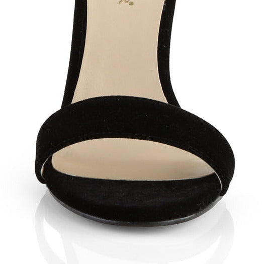 Black velvet ankle strap stiletto heel shoes on a white background