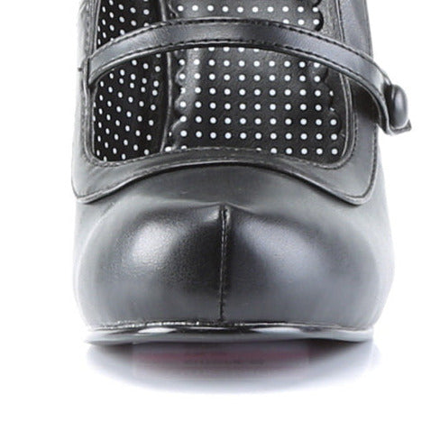 Black vintage-style mary jane shoe with a strap on a white background