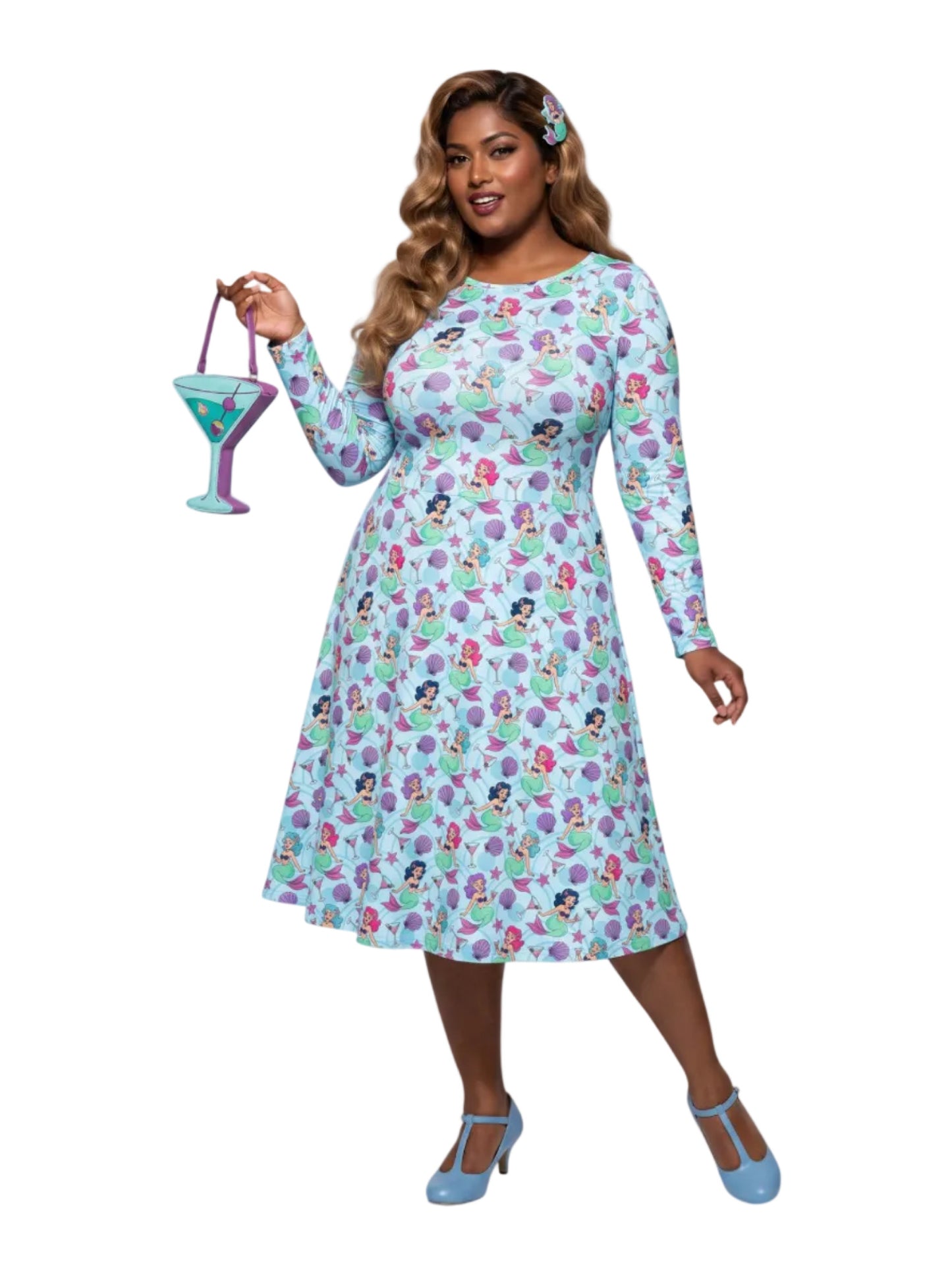 Plus size woman wearing light blue Mermaids and Martinis long sleeve pinup dress with pockets