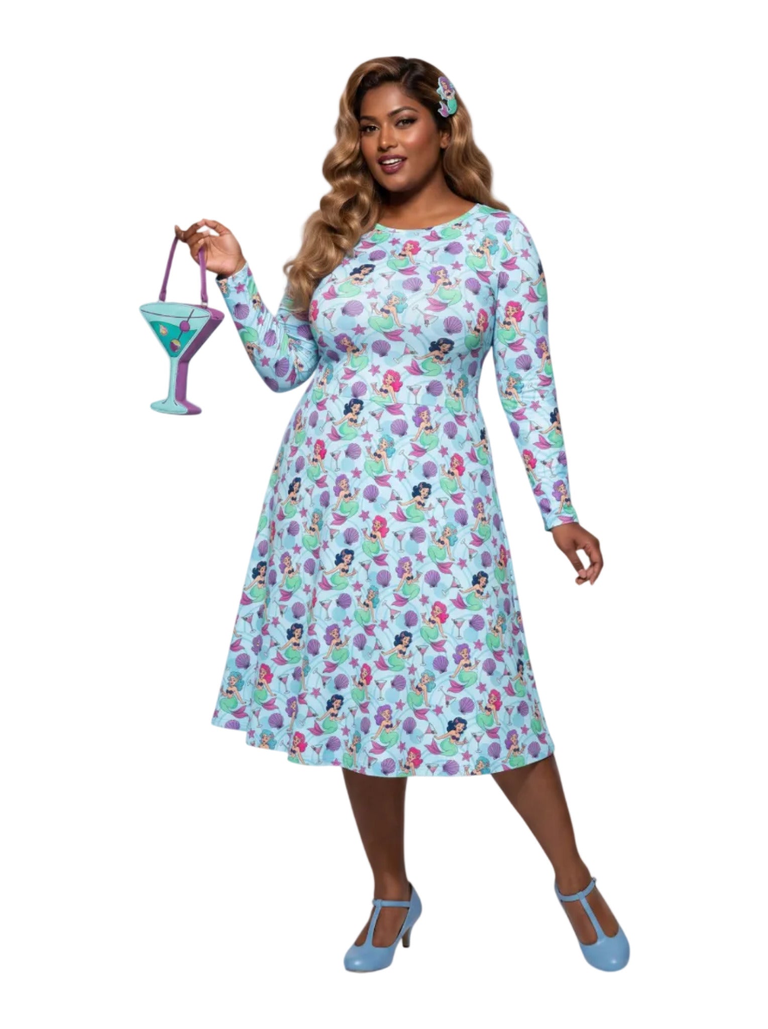 Plus size woman wearing light blue Mermaids and Martinis long sleeve pinup dress with pockets