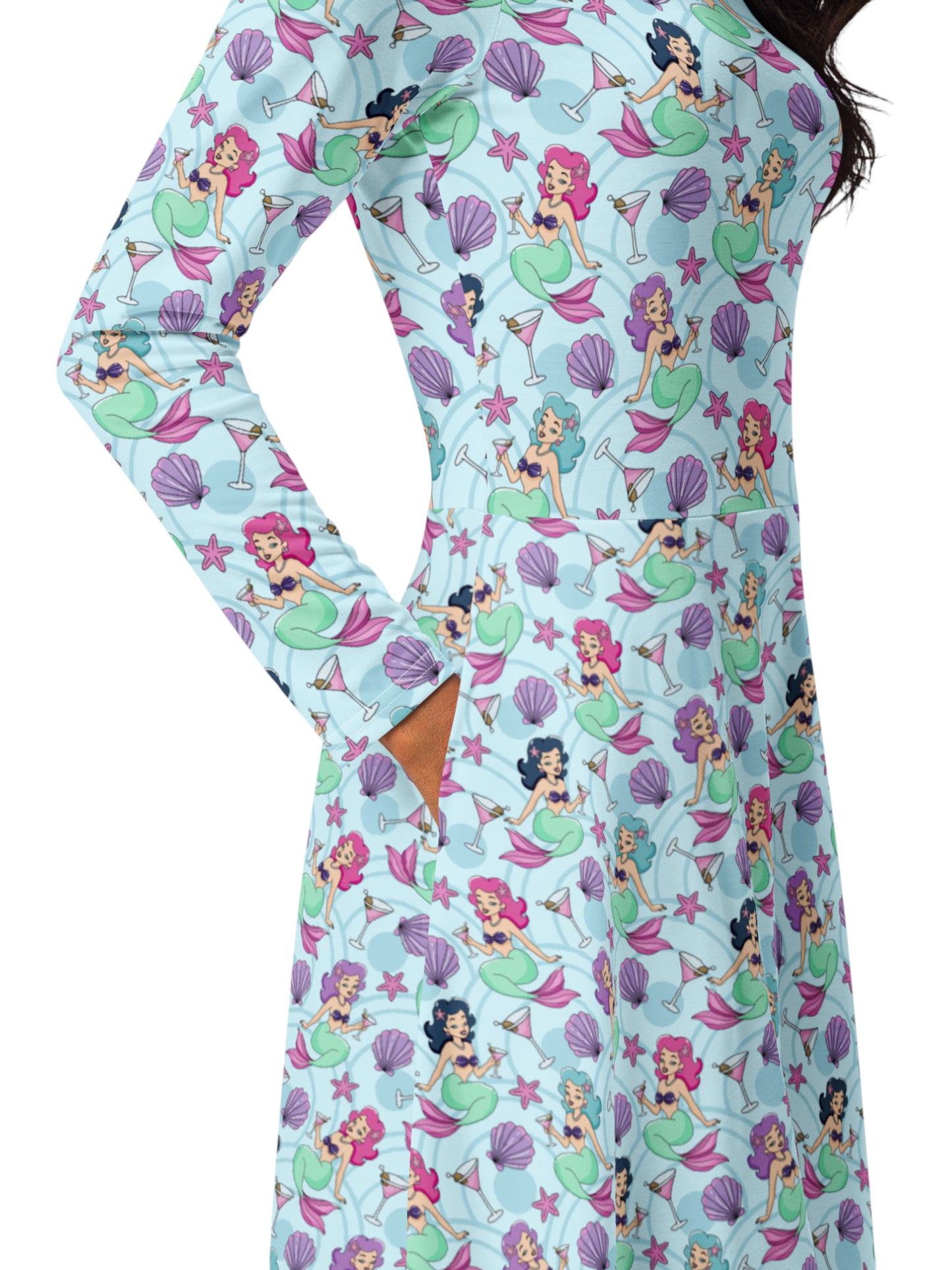Plus size woman wearing light blue Mermaids and Martinis long sleeve pinup dress with pockets