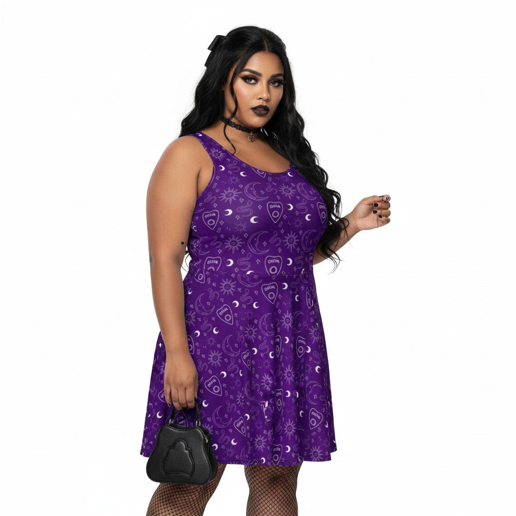 Woman wearing a plus size purple Gothic skater dress with a white Ouija board cursor and celestial pattern.