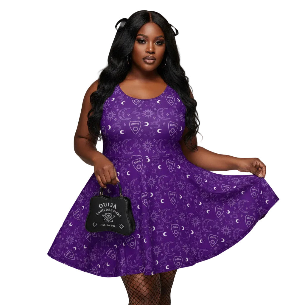 Woman wearing a purple Gothic skater dress with a white Ouija board cursor and celestial pattern.