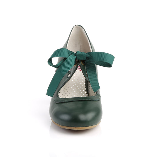 Green faux leather Mary Jane shoes with a 2.5-inch Cuban kitten heel, ribbon tie closure, and heart cutout detailing in a 1950s pin-up style.