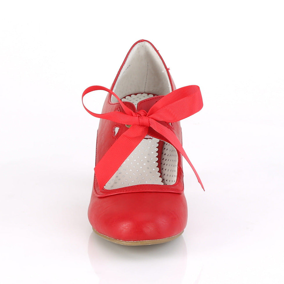 Red faux leather Mary Jane shoes with a 2.5-inch Cuban kitten heel, ribbon tie closure, and heart cutout detailing in a 1950s pin-up style.
