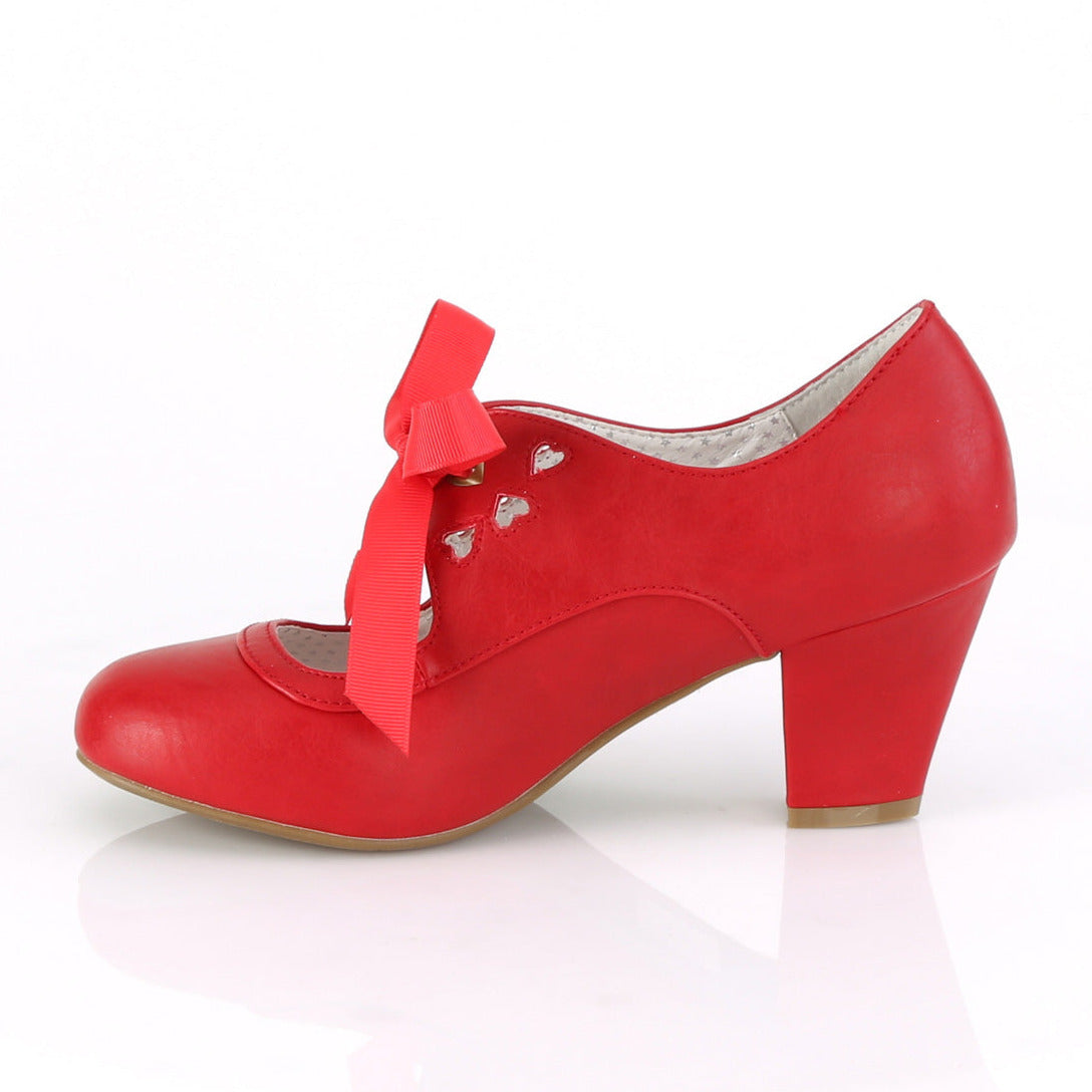 Red faux leather Mary Jane shoes with a 2.5-inch Cuban kitten heel, ribbon tie closure, and heart cutout detailing in a 1950s pin-up style.