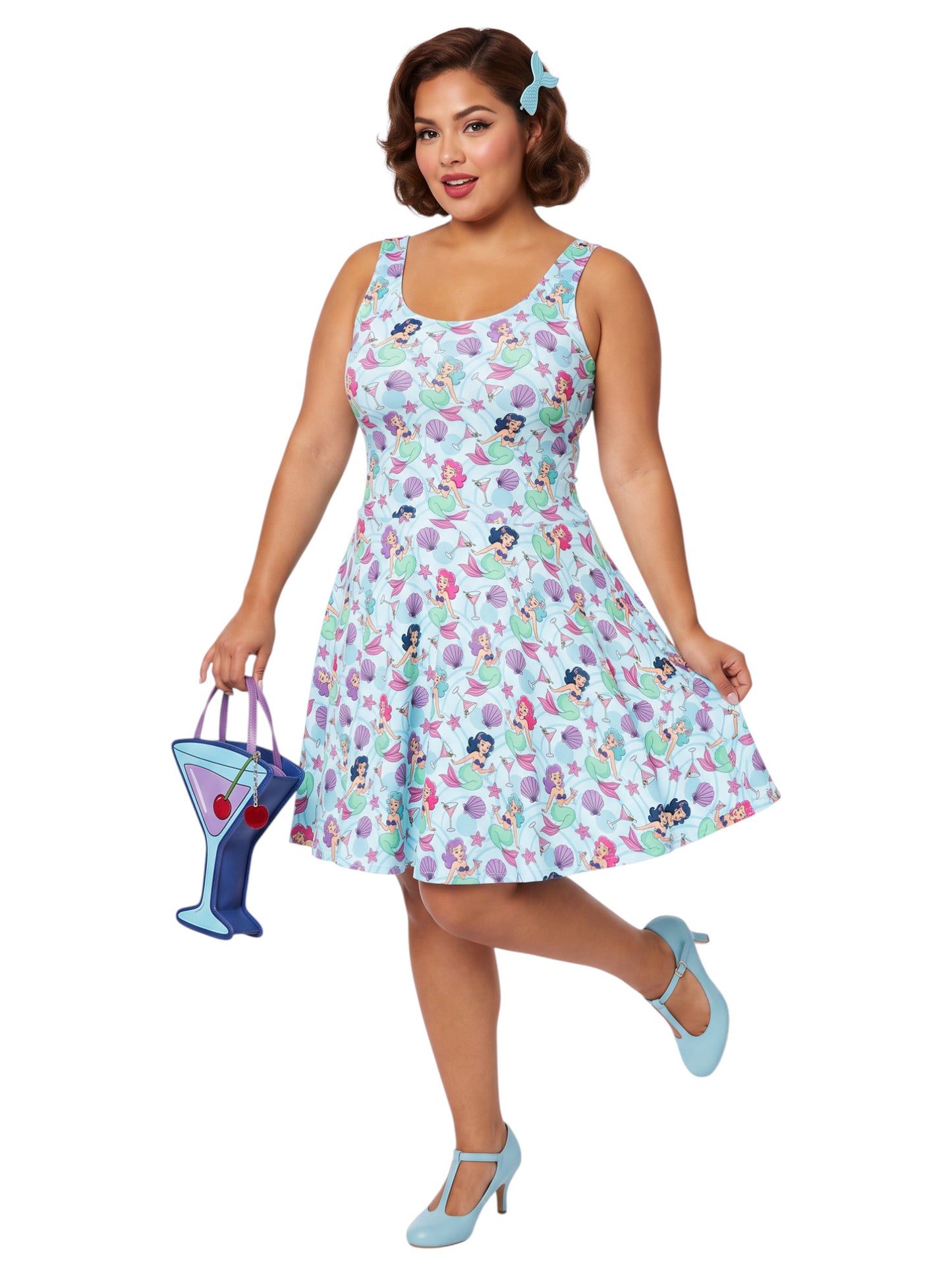 Curvy woman wearing a blue Mermaid and Martinis swing dress with a fit and flare silhouette.