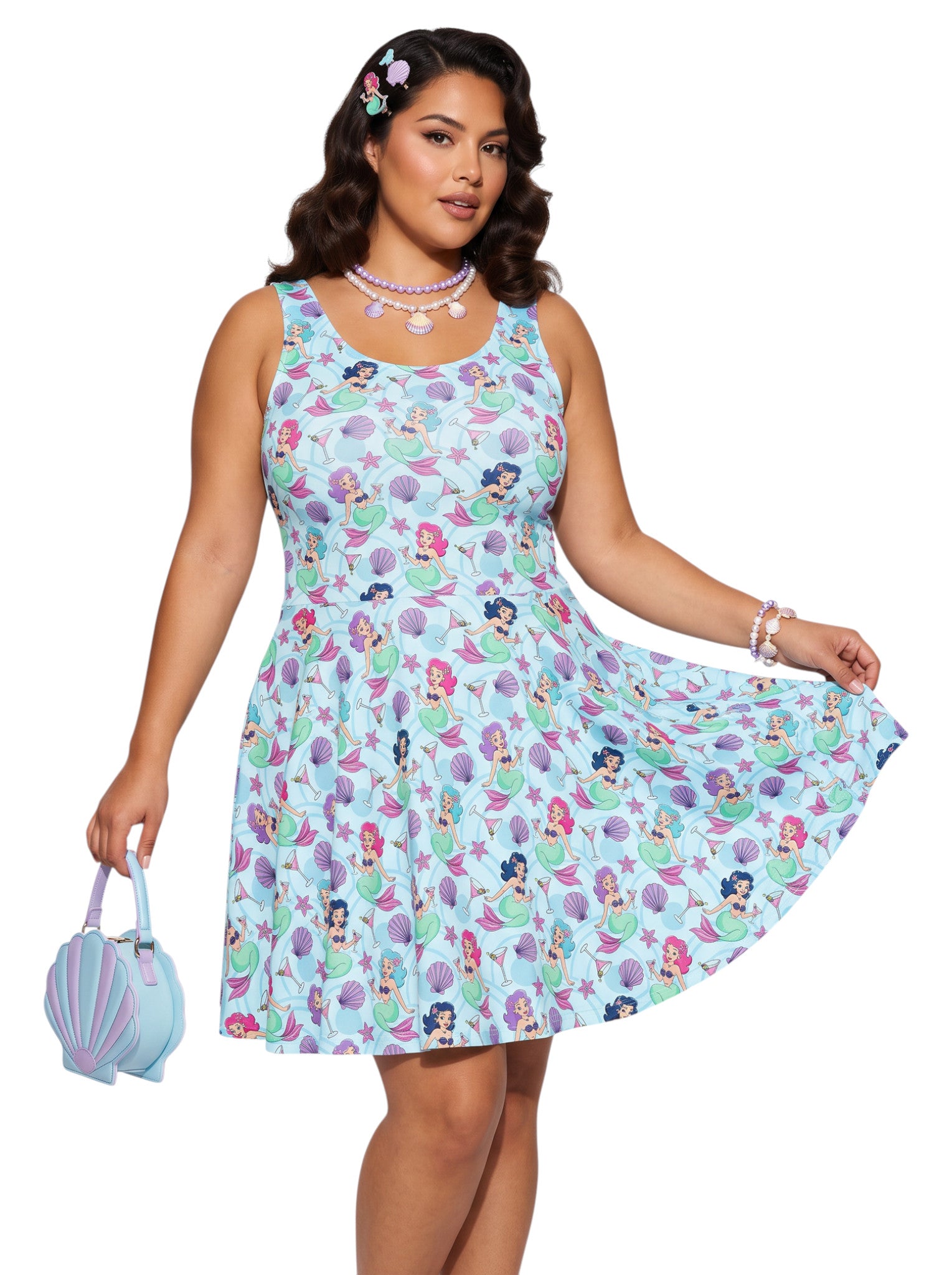 Curvy woman wearing a blue Mermaid and Martinis swing dress with a fit and flare silhouette.