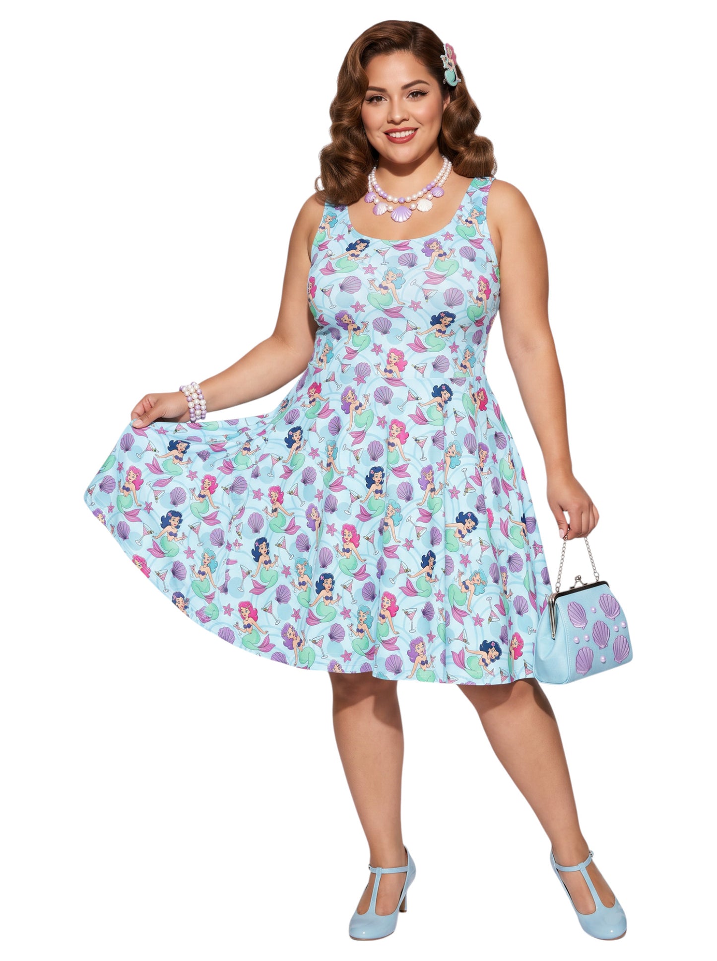 Curvy woman wearing a blue Mermaid and Martinis swing dress with a fit and flare silhouette.