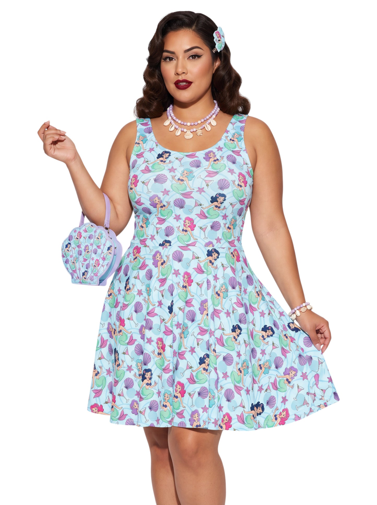 Curvy woman wearing a blue Mermaid and Martinis swing dress with a fit and flare silhouette.