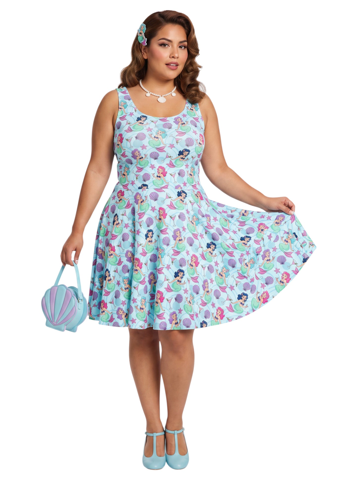 Curvy woman wearing a blue Mermaid and Martinis swing dress with a fit and flare silhouette.