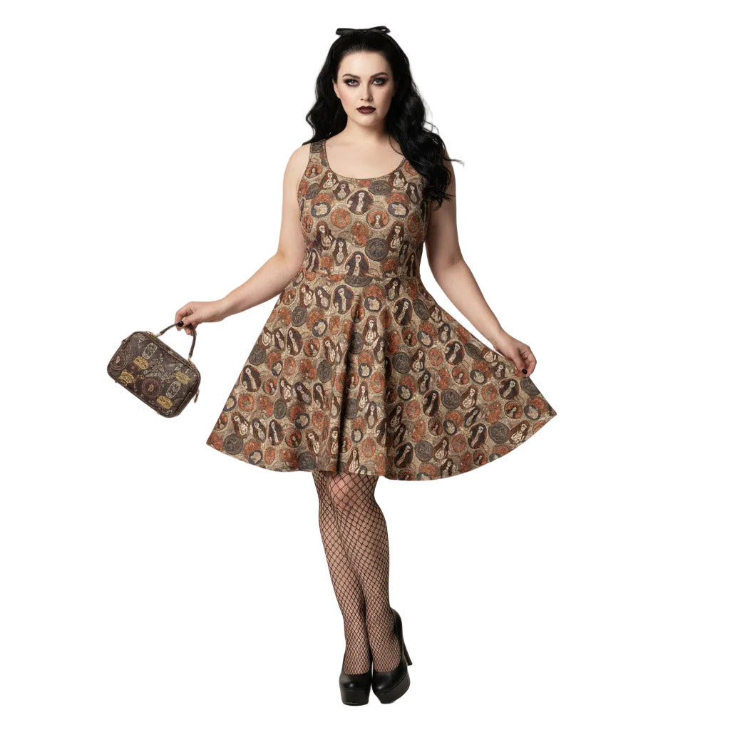 Woman wearing a cream and brown Whimsigoth skater dress with a vintage tarot card goddess medallion print.