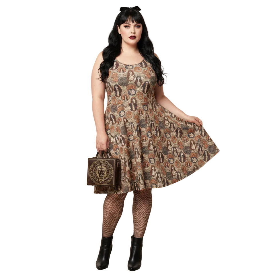 Woman wearing a cream and brown Whimsigoth skater dress with a vintage tarot card goddess medallion print.
