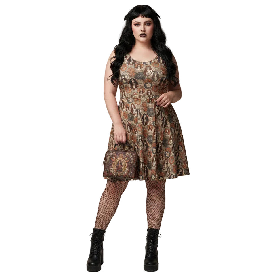 Woman wearing a cream and brown Whimsigoth skater dress with a vintage tarot card goddess medallion print.