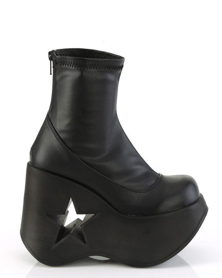 Black stretch faux leather platform wedge ankle boots for festivals with 5-inch star cutout heel and back metal zipper.
