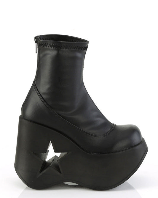 Black stretch faux leather platform wedge ankle boots for festivals with 5-inch star cutout heel and back metal zipper.