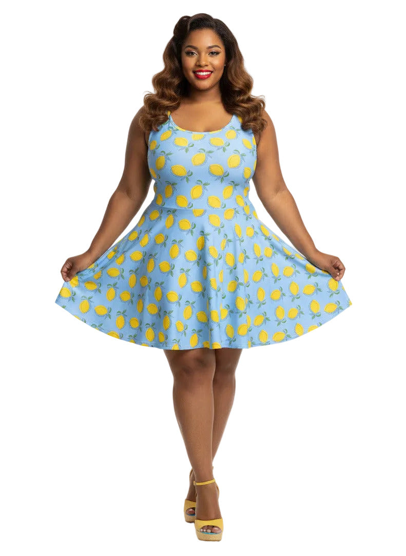 Plus size woman in blue lemon print vintage 50s swing dress with fit and flare silhouette.