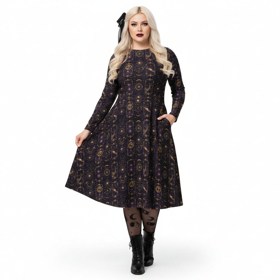 Woman wearing a celestial patterned dress on a white background