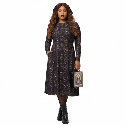 Woman wearing a celestial patterned dress holding a handbag on a white background