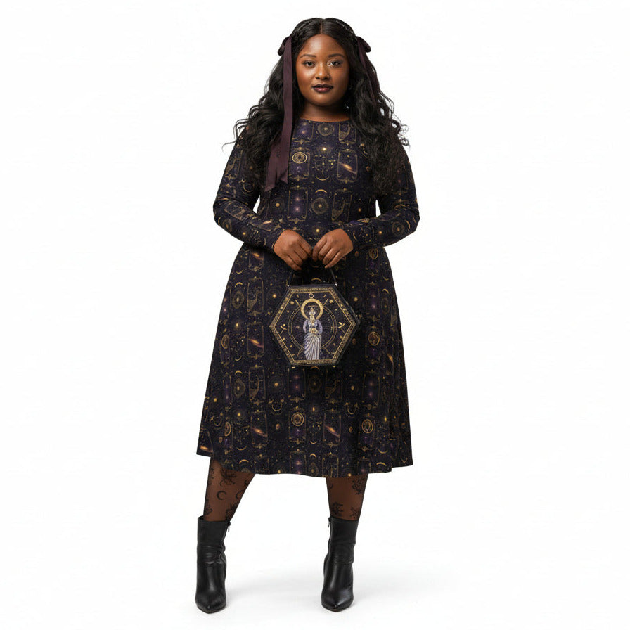 Woman wearing a celestial patterned dress holding a hexagonal clutch on a white background