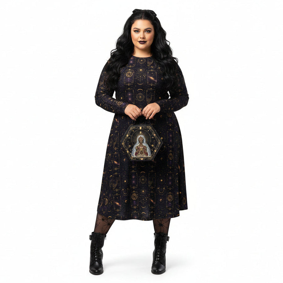 Woman wearing a black celestial patterned dress with intricate designs on a white background