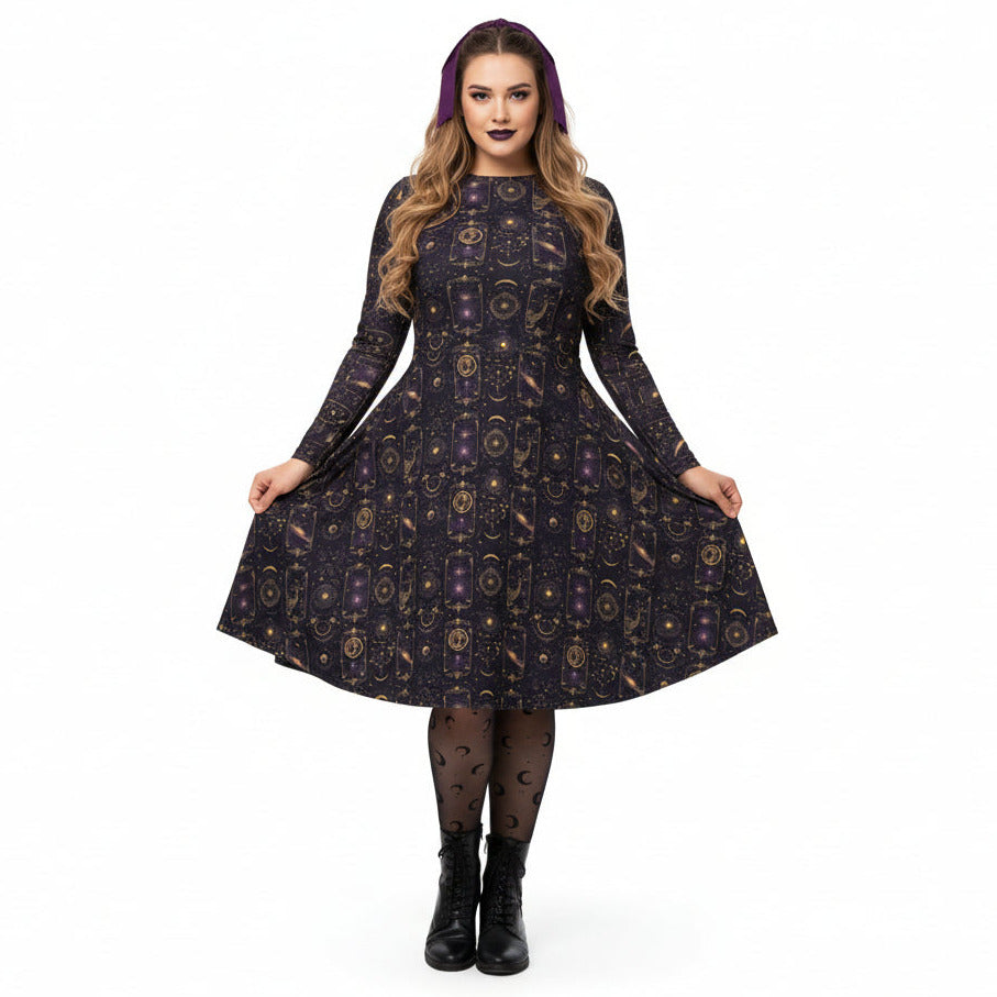 Woman wearing a celestial patterned dress on a white background