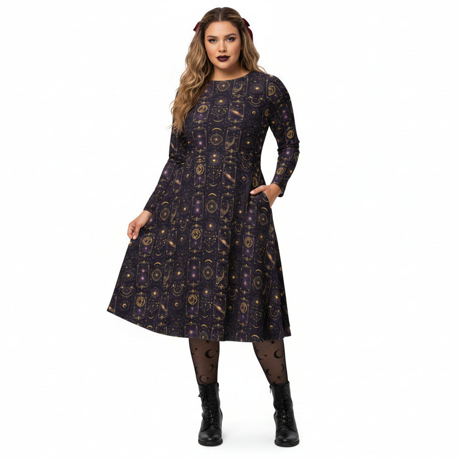 Woman wearing a celestial patterned dress on a white background