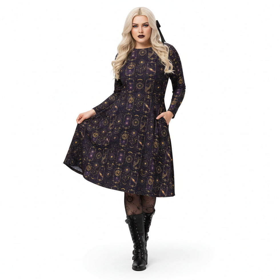 Woman wearing a celestial patterned dress with long sleeves on a white background