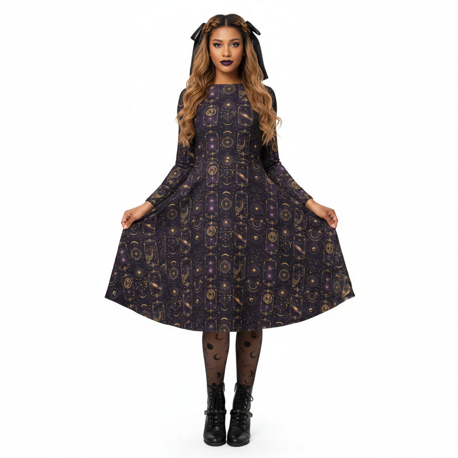 Woman wearing a celestial patterned dress on a white background