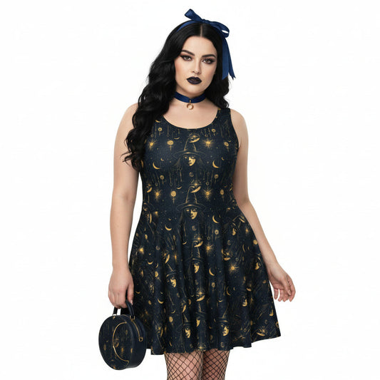 Woman wearing a black dress with gold celestial pattern, holding a matching handbag on a white background