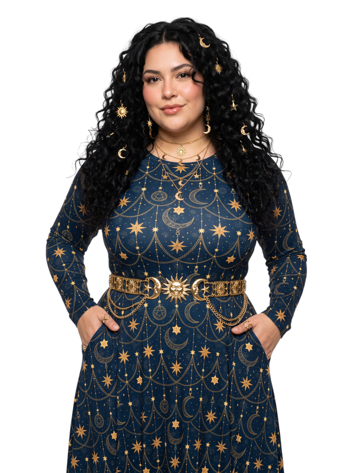A woman with long, curly black hair wearing a navy blue long-sleeve dress decorated with gold celestial patterns, including stars, moons, and chains, along with a matching gold belt.