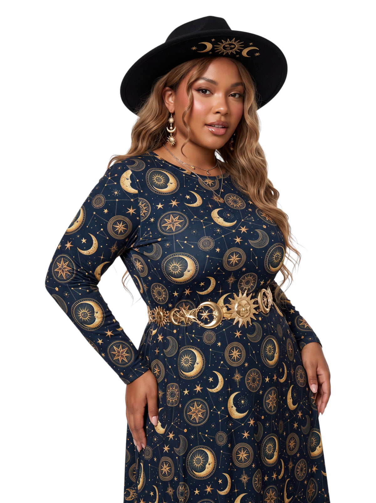 A woman modeling a long-sleeve navy dress with a gold celestial print of moons, stars, and suns, accessorized with a matching gold belt and a black wide-brim hat with a gold sun design, against a plain white background.