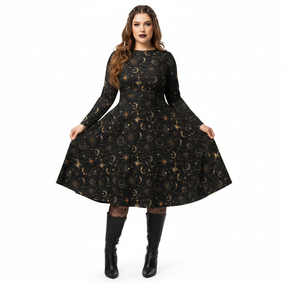 Woman wearing a black dress with celestial sun moon and stars print on a white background