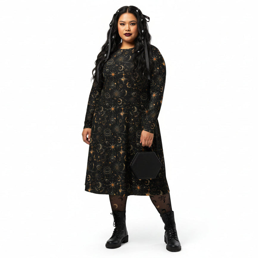 Woman wearing a black dress with celestial sun moon and stars print on a white background