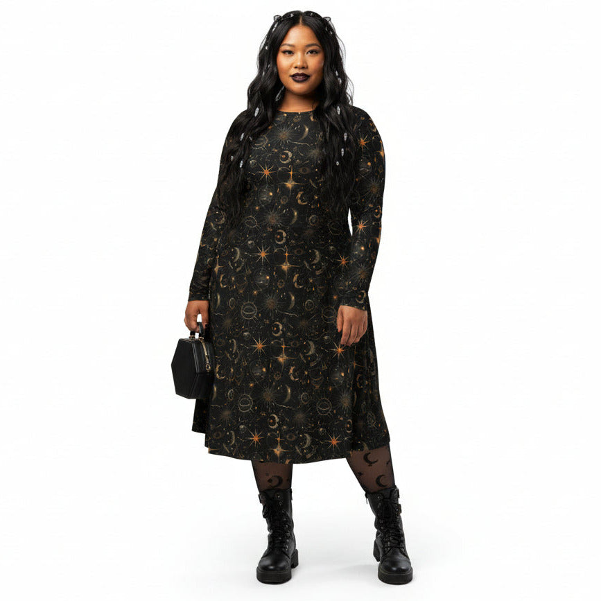 Woman wearing a black dress with celestial sun moon and stars print on a white background