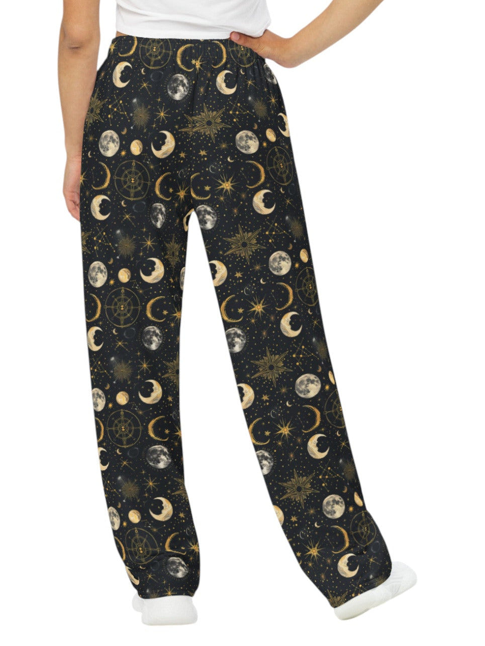 Woman wearing Whimsigoth celestial wide leg lounge pants with sun, moon, and star print.