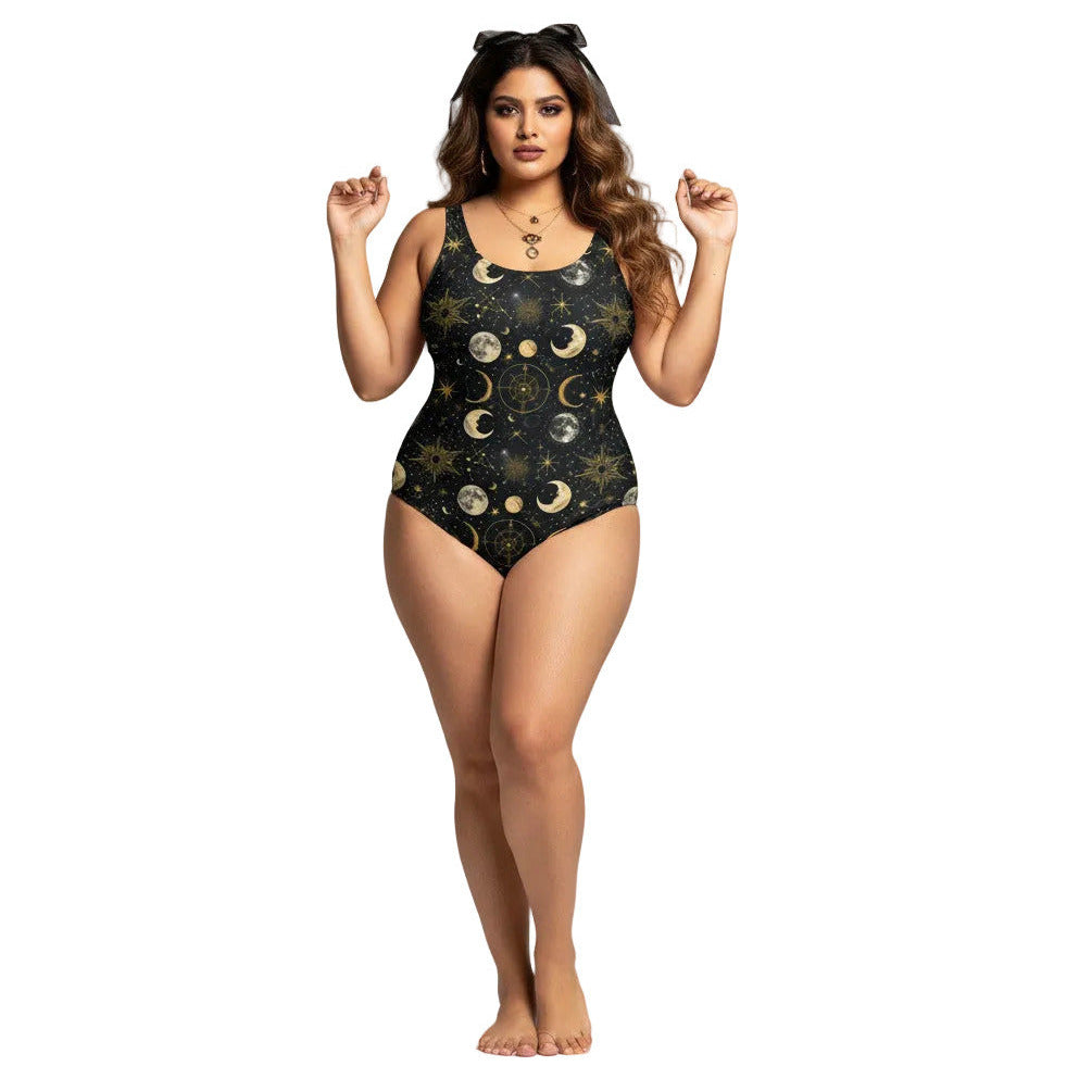 Plus size woman wearing a black celestial one piece swimsuit with gold sun, moon, and star patterns in a gothic style.