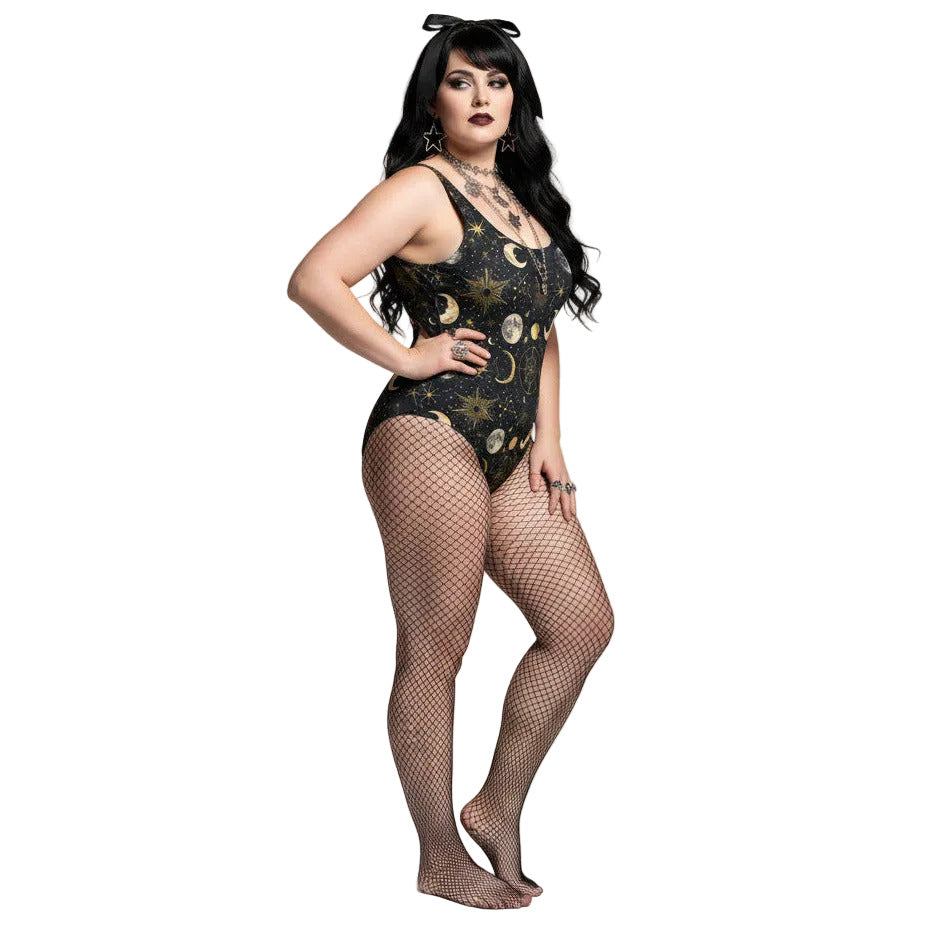 Plus size woman wearing a black celestial one piece swimsuit with gold sun, moon, and star patterns in a gothic style.